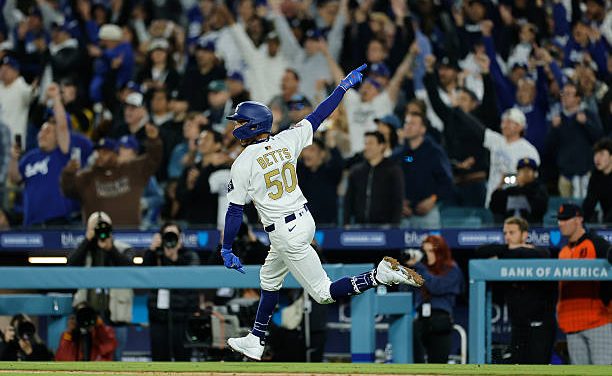 Mookie Betts celebrates a three-run walk-off homer in the 10th inning to lift the Dodgers to an 8-5 win over the Detroit Tigers on Friday night.