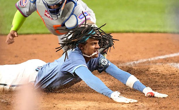 C J Abrams beats the tag to score the game-winning run on a walk-off single by fellow Bro, James Woods as the Nationals topped the Mets, 5-4, on Friday night.