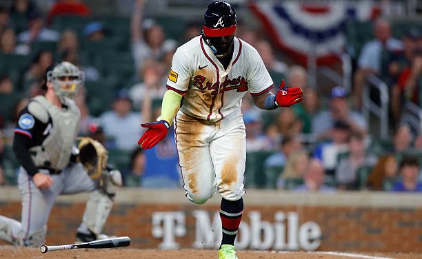 Michael Harris II reacts to 1 of his 3 hits on Friday night as the Braves beat the Marlins, 10-1, in Atlanta for their first win of the season.